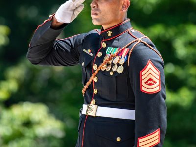 Marine standing in salute